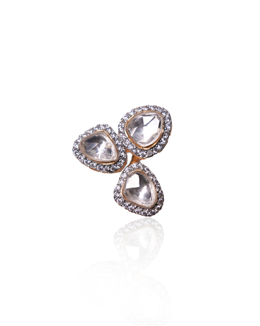 Vasundhara’s Mira Ring, featuring three kundan stones and diamond halos, captured in a close-up shot on a white background.