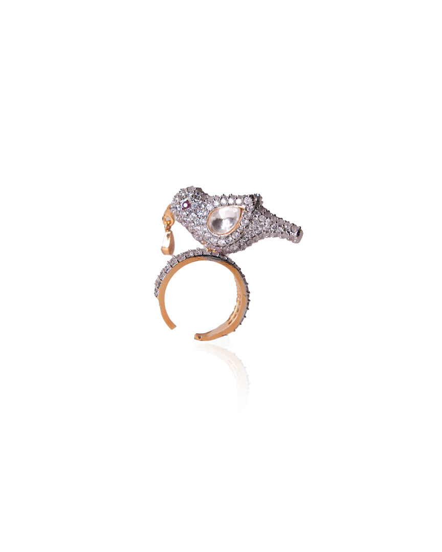 Charming product shot of Sharanya Ring by Vasundhara, diamond-studded bird motif with kundan centerpiece and gold finish.