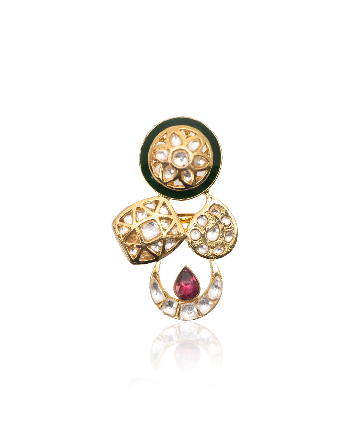 Close-up of Vasundhara’s Indira Ring, handcrafted gold and pearl design with green enamel and ruby, placed in white display.