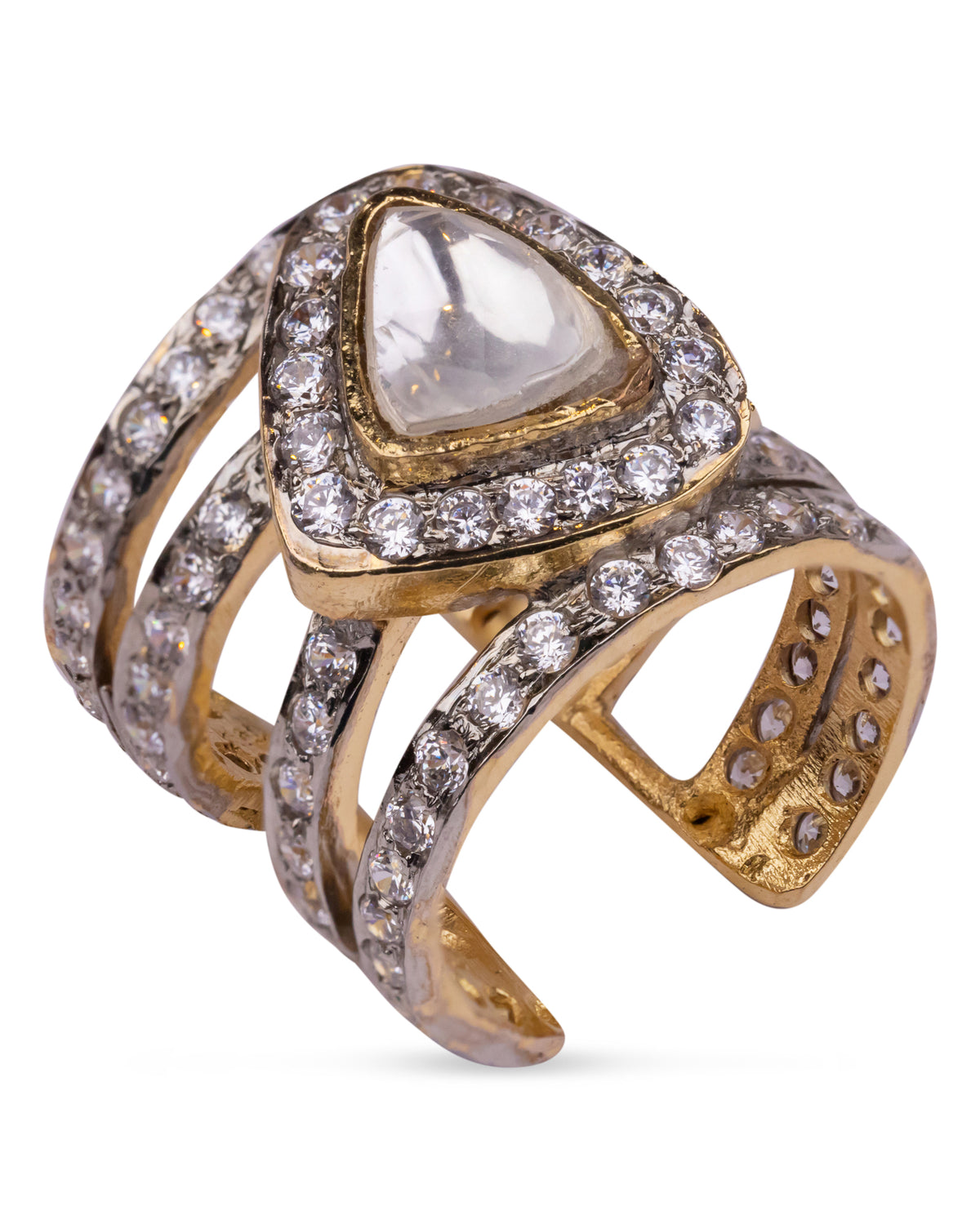 Vasundhara’s Iqra Ring, bold gold and diamond-studded band with a pear-shaped kundan stone placed on white display.