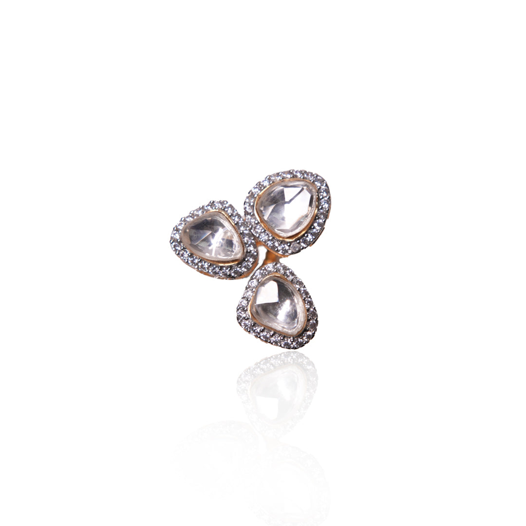 Vasundhara’s Mira Ring, featuring three kundan stones and diamond halos, captured in a close-up shot on a white background.