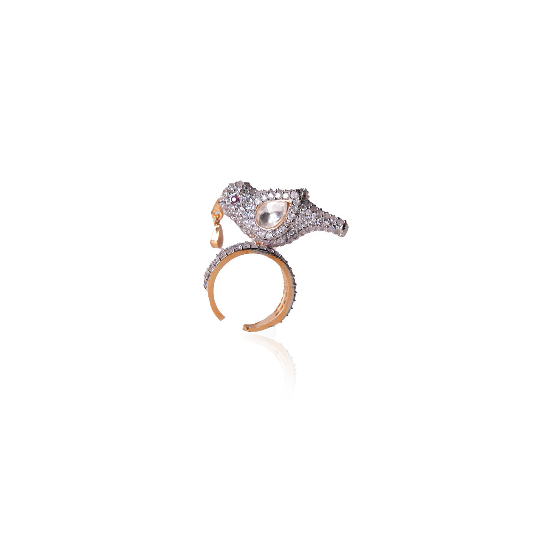 Charming product shot of Sharanya Ring by Vasundhara, diamond-studded bird motif with kundan centerpiece and gold finish.