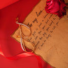 Vasundhara's Premier Earrings are displayed on a red romantic background