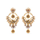 Traditional Masuma Earrings from Vasundhara with pearls, kundan, and pink gemstones, placed on a white backdrop.