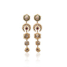 Gold Hira Earrings by Vasundhara with intricate pearl borders and gemstone details, captured on a white background.