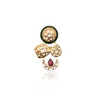 Close-up of Vasundhara’s Indira Ring, handcrafted gold and pearl design with green enamel and ruby, placed in white display.
