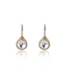 Geetika Earrings with Kundan stone Posed Against a White Setting