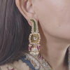 Framing the ear, Vasundhara’s Suhani Earring features curved kundan design, pink beads, and delicate pearl accents.