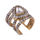 Vasundhara’s Iqra Ring, bold gold and diamond-studded band with a pear-shaped kundan stone placed on white display.