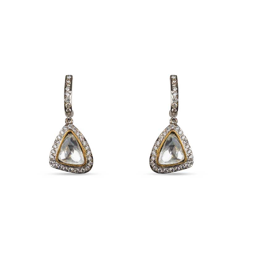 Closer view of the modern earrings with diamantes and kundan drop on white background 